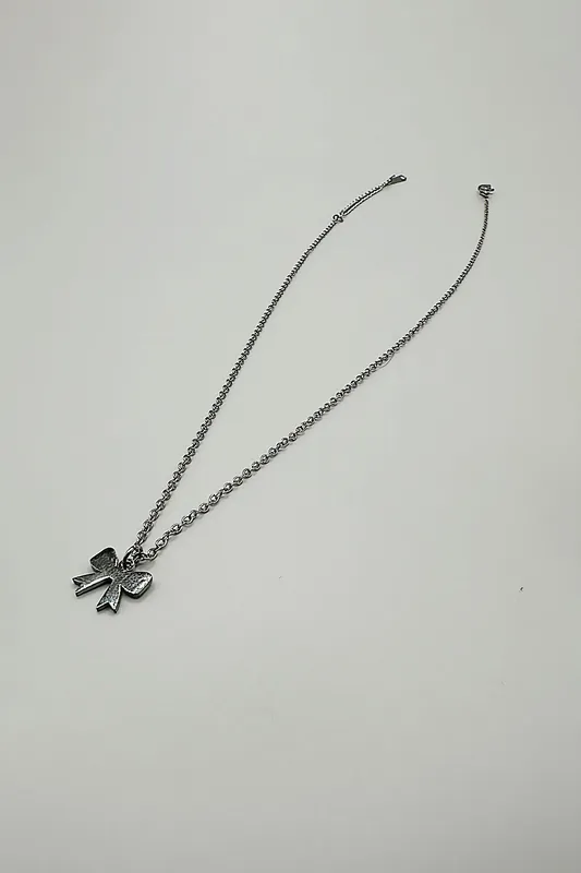 Mini Bow Pendant Necklace in Silver - SVNX