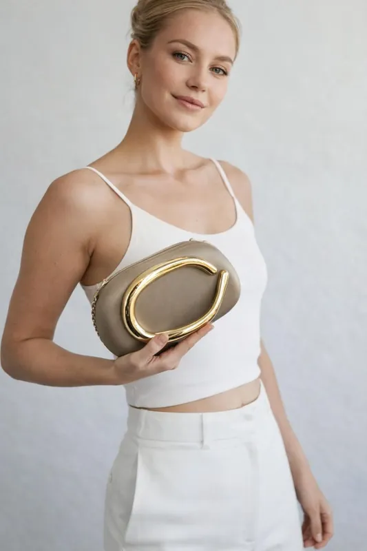 Oval Satin Hard Case Clutch Bag In Muted Gold - SVNX